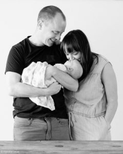 Black and white baby and family portrait at home in Singapore