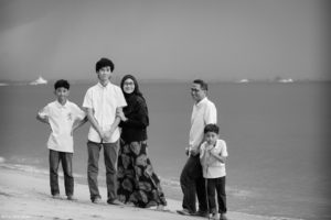 Black and white beach family photoshoot in Singapore