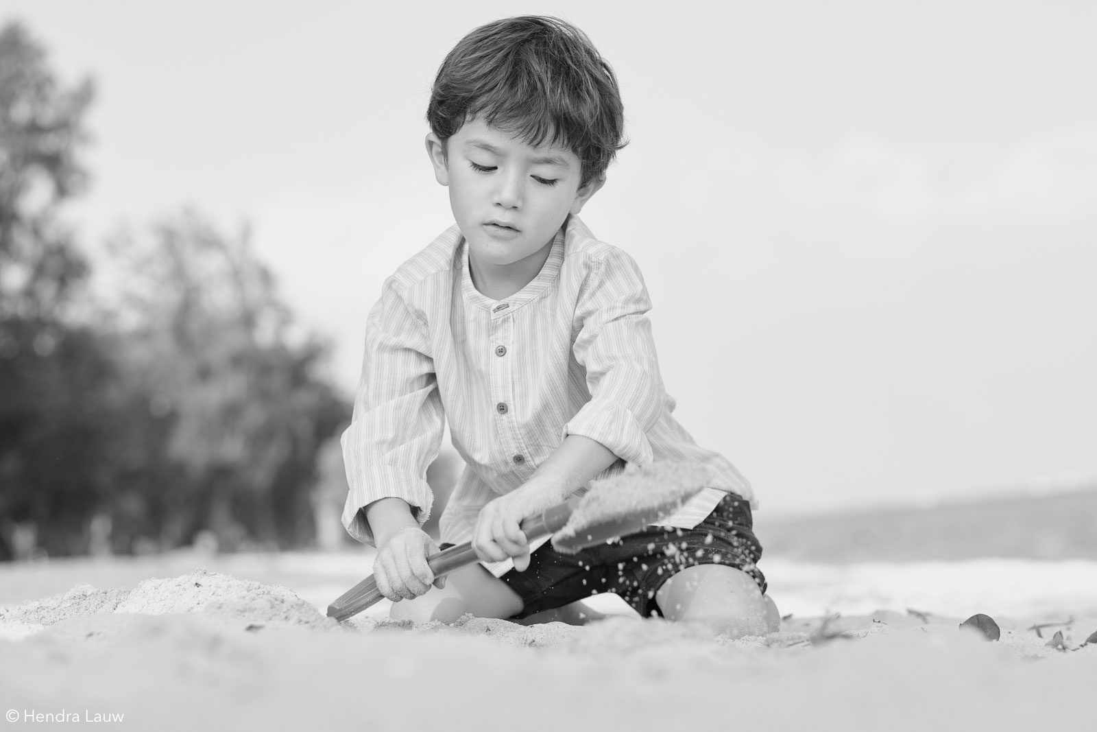 Black and white children beach photography in Singapore