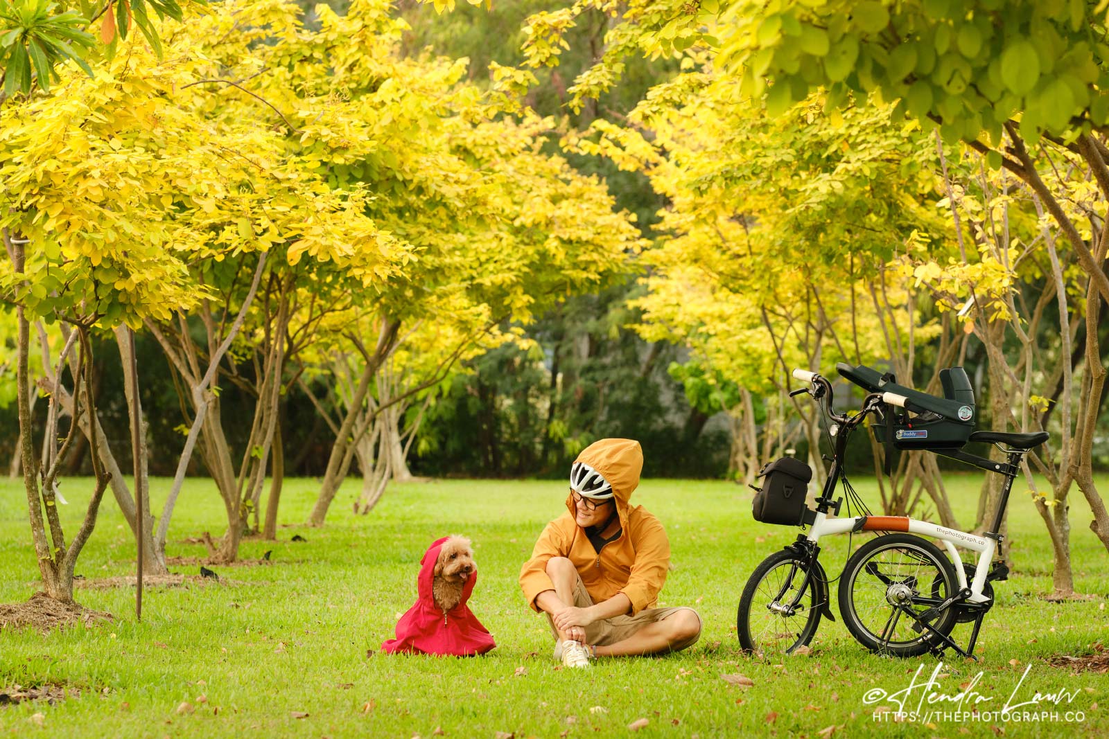 A photographer with his bike and his poodle at East Coast Park Singapore