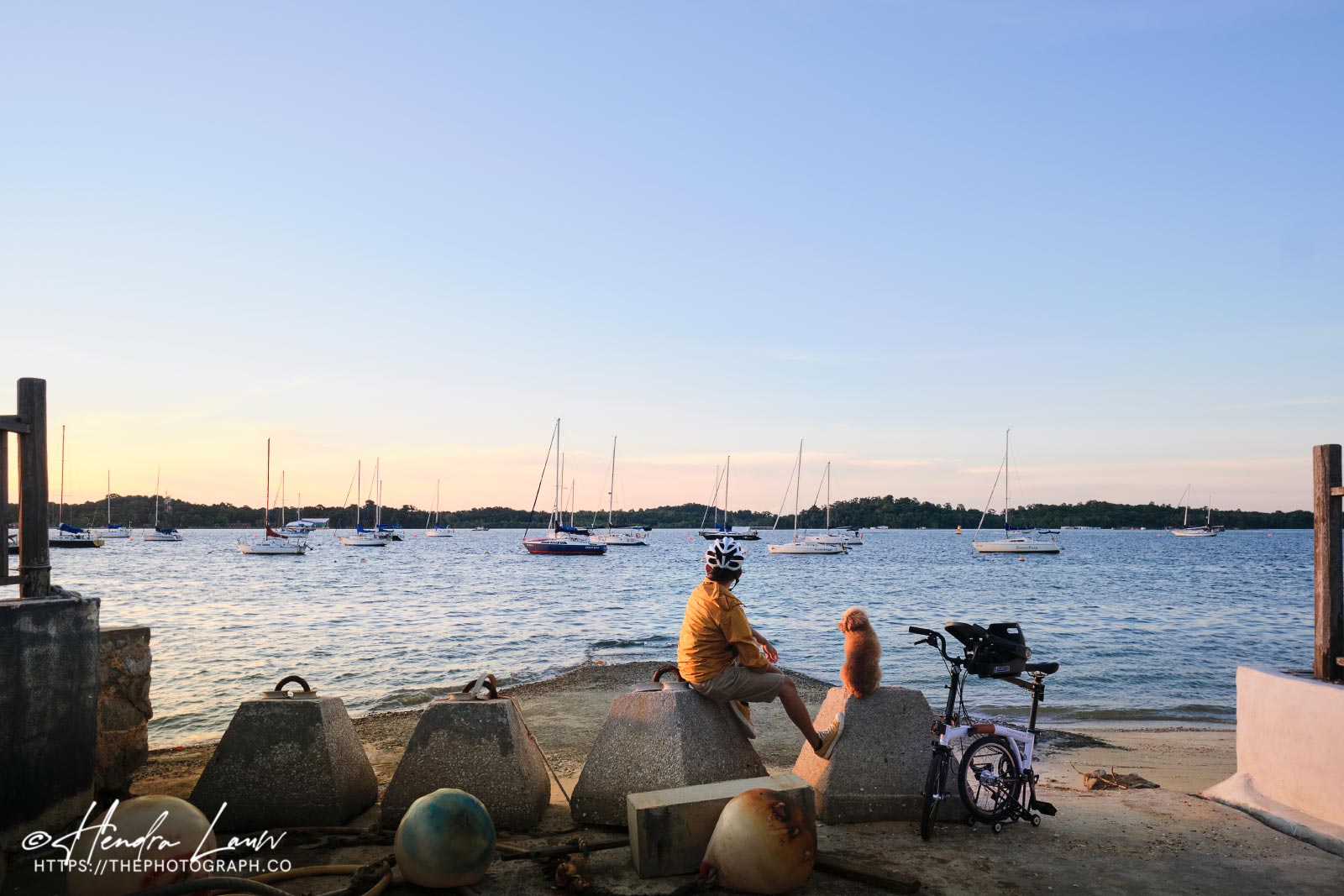 Singapore photographer and his dog at Changi Beach during sunset